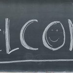 A welcome message is pictured written on a classroom chalkboard.
